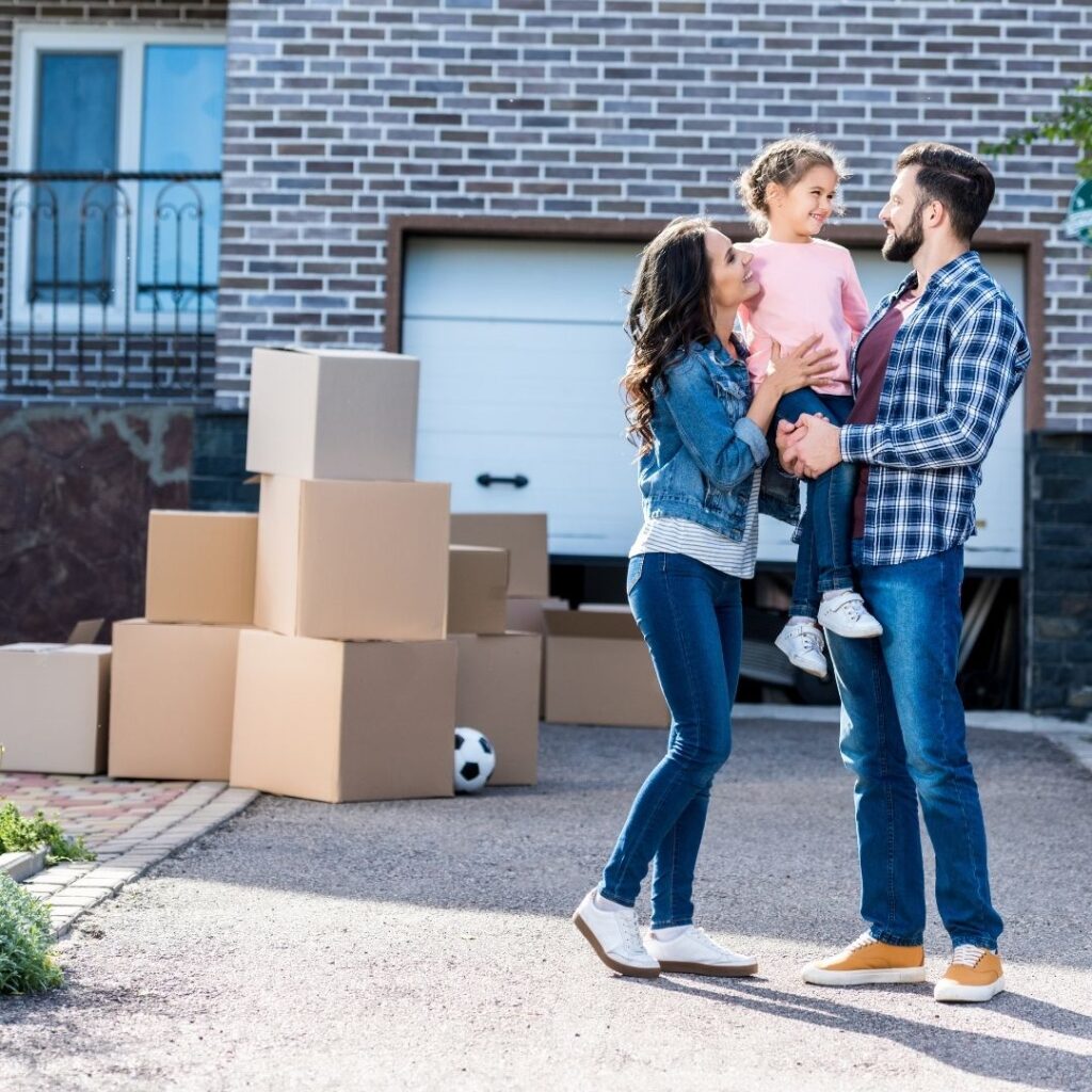 a family excitedly packs boxes