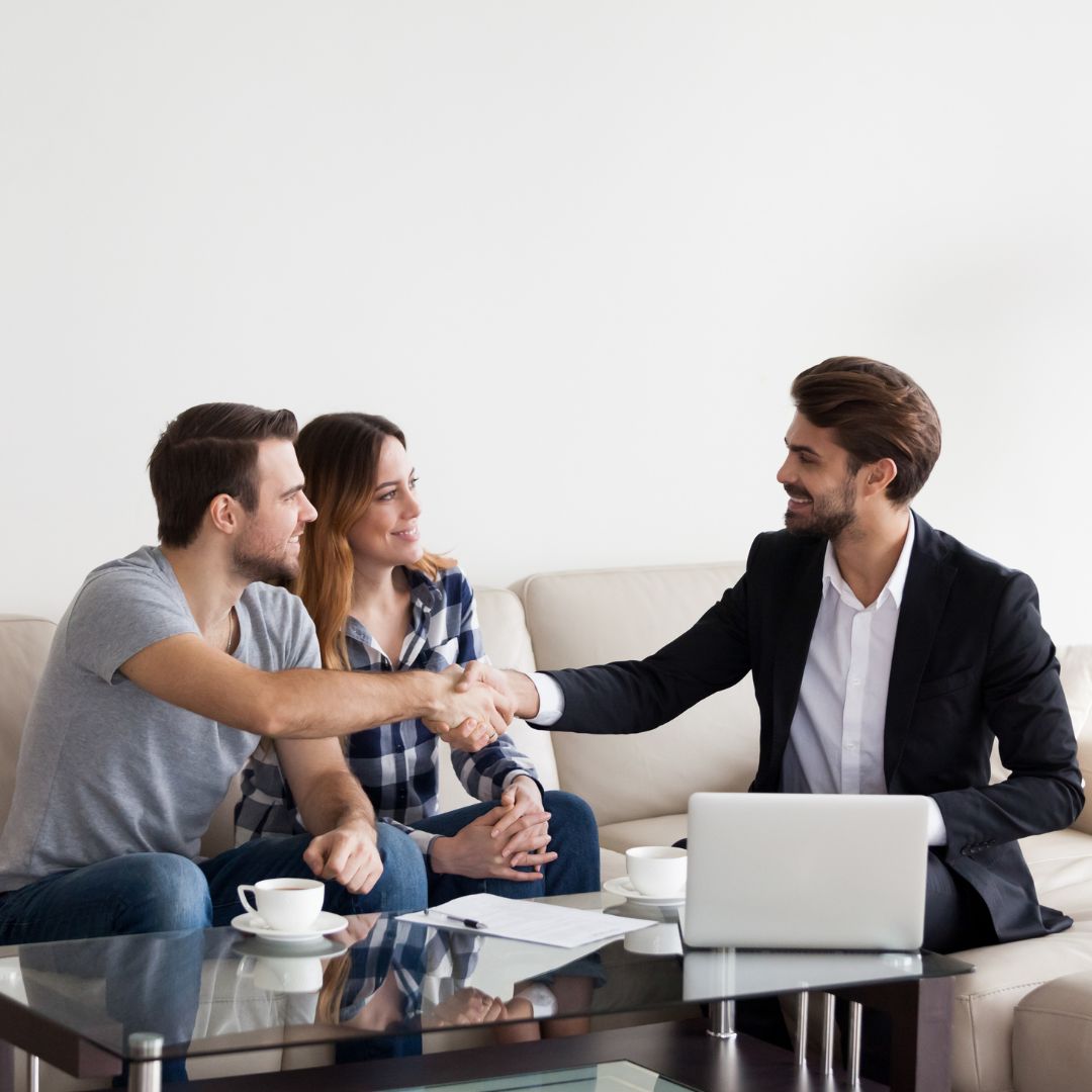 A real estate agent with a couple