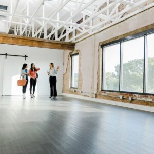 a commercial real estate agent showing an empty office space