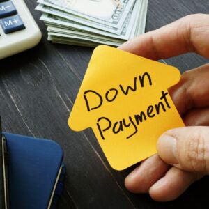 person holding a sign that says down payment