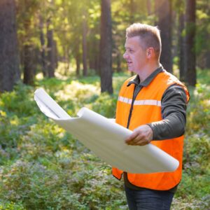 man looking at a map to build